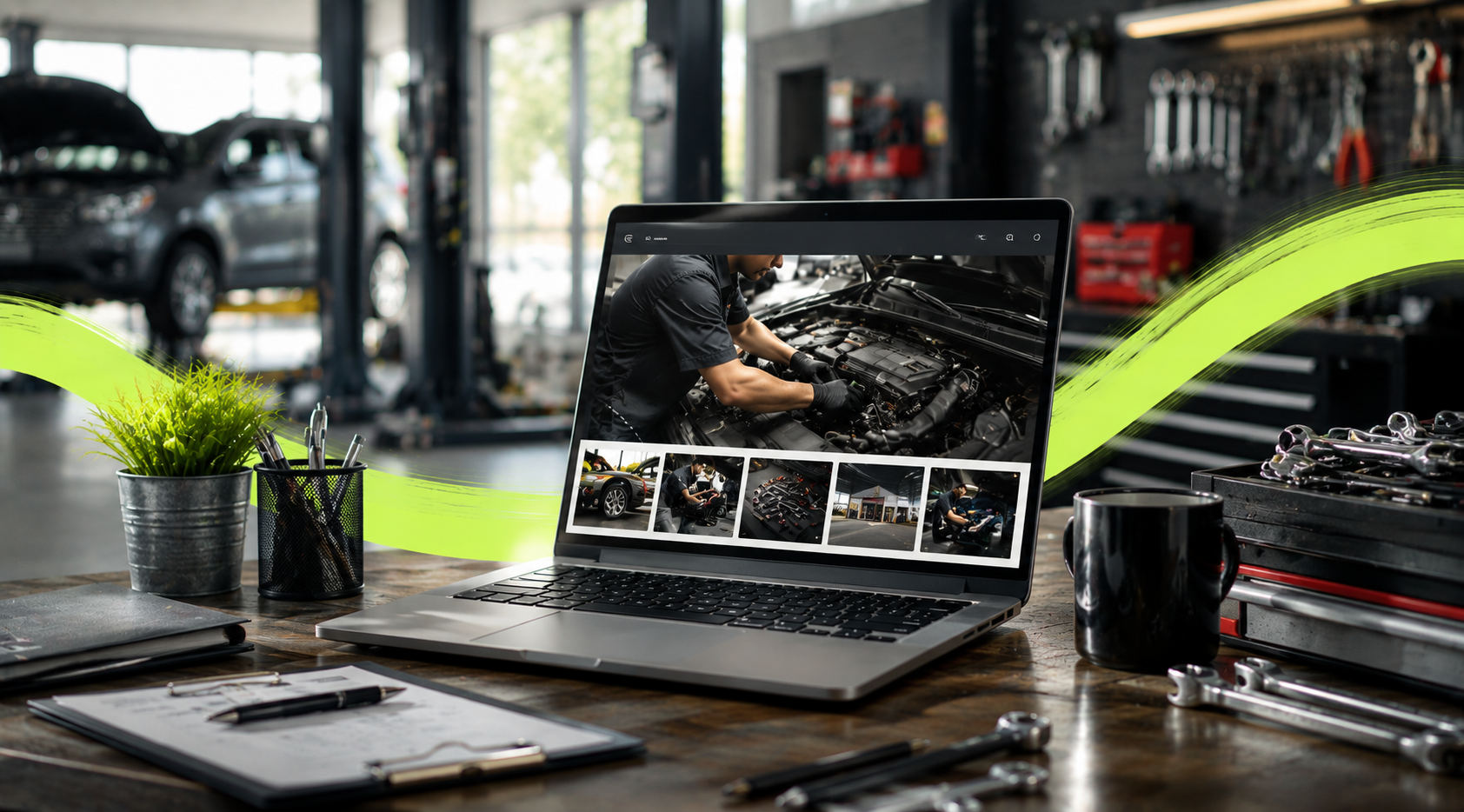 Laptop on a workbench displaying a mechanic repairing a car engine in a busy auto shop.