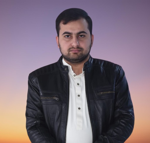 Portrait of a man facing the camera, wearing a black leather jacket over a white shirt, with a sunset gradient background.