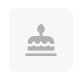 Icon of a birthday cake with candles on a plate, set against a light rounded square background.
