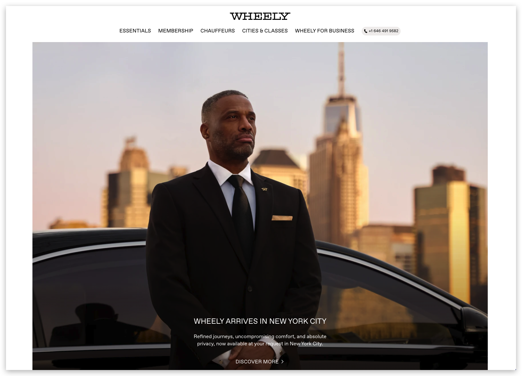 image - Local Branding, Web Design & Digital Marketing Agency Professional man in a black suit standing beside a black car with a city skyline in the background, conveying premium chauffeur service